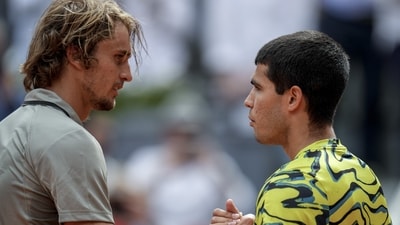 Alexander Zverev, of Germany, left, shakes hands with Carlos Alcaraz, of Spain, at the ne of the match at the Madrid Open (AP) Alexander Zverev, of Germany, left, shakes hands with Carlos Alcaraz, of Spain, at the ne of the match at the Madrid Open (AP)