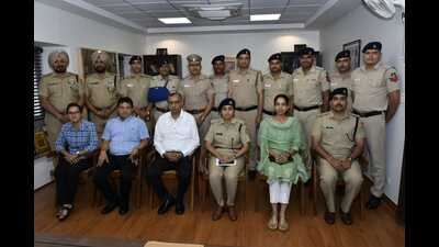 The awardees with senior Chandigarh Police officers. (HT Photo)