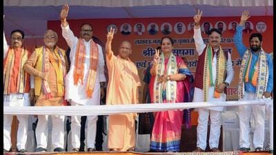UP chief minister Yogi Adityanath along with deputy chief minister Brajesh Pathak shows a victory sign during an election campaign for BJP’s mayor and parshad candidates at Teli Bagh area, in Lucknow on Tuesday. (ANI Photo) UP chief minister Yogi Adityanath along with deputy chief minister Brajesh Pathak shows a victory sign during an election campaign for BJP’s mayor and parshad candidates at Teli Bagh area, in Lucknow on Tuesday. (ANI Photo)