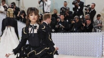 Jenna Ortega paid homage to fashion designer Karl Lagerfeld in a black victorian gown featuring golden chain details and an elaborate look. (Reuters) Jenna Ortega paid homage to fashion designer Karl Lagerfeld in a black victorian gown featuring golden chain details and an elaborate look. (Reuters)