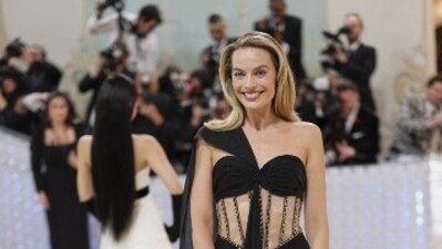 Margot Robbie picked a black silk gown with corset details, golden embellishment patterns and a black silk train, completed with minimal makeup. (Reuters) Margot Robbie picked a black silk gown with corset details, golden embellishment patterns and a black silk train, completed with minimal makeup. (Reuters)