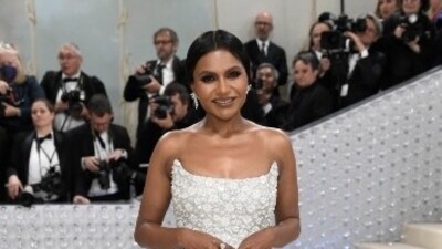 Mindy Kaling looked ethereal in a white embellished gown as she accessorised her look in matching diamond ear studs, teamed with a clean hair bun. (AP) Mindy Kaling looked ethereal in a white embellished gown as she accessorised her look in matching diamond ear studs, teamed with a clean hair bun. (AP)
