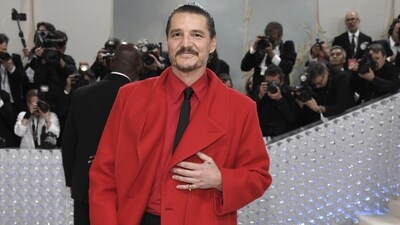 Pedro Pascal arrived at The Metropolitan Museum of Art's Costume Institute benefit gala. He opted for a red shirt, black shorts, a tie, and a long red coat. (AP) Pedro Pascal arrived at The Metropolitan Museum of Art's Costume Institute benefit gala. He opted for a red shirt, black shorts, a tie, and a long red coat. (AP)