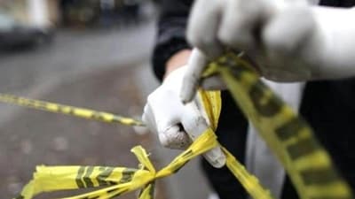 A forensic technician ties a used police line together to seal off a crime scene in Monterrey. (Reuters Photo/Representative Image) A forensic technician ties a used police line together to seal off a crime scene in Monterrey. (Reuters Photo/Representative Image)