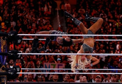 Rhea Ripley and Charlotte Flair wrestle for the Smackdown women's championship during WrestleMania Goes Hollywood at SoFi Stadium. (Getty Images via AFP) Rhea Ripley and Charlotte Flair wrestle for the Smackdown women's championship during WrestleMania Goes Hollywood at SoFi Stadium. (Getty Images via AFP)