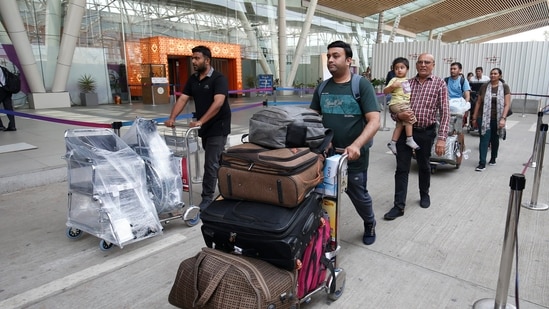 Indian nationals, evacuated from violence-hit Sudan under Operation Kaveri, upon their arrival in Ahmedabad, Tuesday, May 2. (PTI)