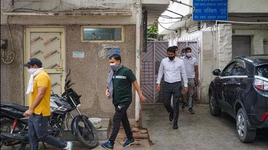 Relatives of Tillu Tajpuria outside the mortuary of Deen Dayal Upadhyay Hospital, in New Delhi. (PTI)