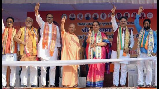 UP chief minister Yogi Adityanath along with deputy chief minister Brajesh Pathak shows a victory sign during an election campaign for BJP’s mayor and parshad candidates at Teli Bagh area, in Lucknow on Tuesday. (ANI Photo)