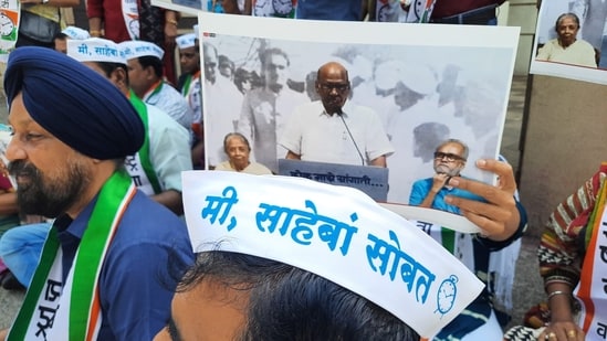 Supporters of NCP chief Sharad Pawar protest against his announcement to step down as the national president of NCP, in Mumbai on Tuesday. (Photo by Bhushan Koyande/ Hindustan Times) Supporters of NCP chief Sharad Pawar protest against his announcement to step down as the national president of NCP, in Mumbai on Tuesday. (Photo by Bhushan Koyande/ Hindustan Times)