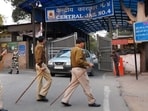 Security personnel stand guard outside at a gate of Tihar Jail. (PTI)