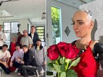 The image shows Sophie the robot and the ten YouTubers she speed dated.
