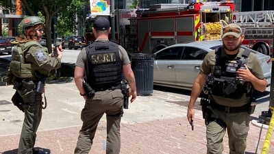 Officers set up near the scene of an active shooter on Wednesday, May 3, 2023 in Atlanta. (AP) Officers set up near the scene of an active shooter on Wednesday, May 3, 2023 in Atlanta. (AP)