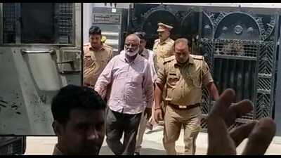 Khan Saulat Haneef being taken to Dhumanganj police station in Prayagraj for questioning, on Wednesday. (HT Photo)