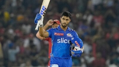 Mumbai Indians batter Tilak Varma celebrates the team's victory in the IPL 2023 cricket match between Punjab Kings and Mumbai Indians at Punjab Cricket Association Stadium, in Mohali, Wednesday, May 3, 2023. (PTI) Mumbai Indians batter Tilak Varma celebrates the team's victory in the IPL 2023 cricket match between Punjab Kings and Mumbai Indians at Punjab Cricket Association Stadium, in Mohali, Wednesday, May 3, 2023. (PTI)