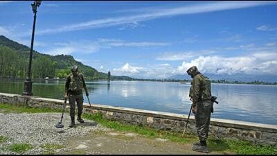 Personnel of paramilitary forces patrol along the banks of Dal Lake in Srinagar on Wednesday. (AFP) Personnel of paramilitary forces patrol along the banks of Dal Lake in Srinagar on Wednesday. (AFP)