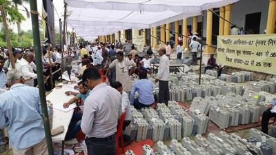 Poll staff wait to collect EVMs in Prayagraj on Wednesday. (ANI PHOTO) Poll staff wait to collect EVMs in Prayagraj on Wednesday. (ANI PHOTO)