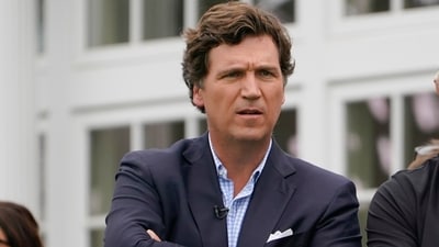 FILE - Tucker Carlson attends the final round of the Bedminster Invitational LIV Golf tournament in Bedminster, N.J., July 31, 2022. A racist text message from Tucker Carlson is what helped drive the commentator's ouster from Fox News, The New York Times reports. The Times says that in a text uncovered as part of a recent defamation lawsuit, the former Fox host lamented how supporters of former President Donald Trump ganged up to beat a protester. “It's not how white men fight,” Carlson wrote. (AP Photo/Seth Wenig, File) (AP) FILE - Tucker Carlson attends the final round of the Bedminster Invitational LIV Golf tournament in Bedminster, N.J., July 31, 2022. A racist text message from Tucker Carlson is what helped drive the commentator's ouster from Fox News, The New York Times reports. The Times says that in a text uncovered as part of a recent defamation lawsuit, the former Fox host lamented how supporters of former President Donald Trump ganged up to beat a protester. “It's not how white men fight,” Carlson wrote. (AP Photo/Seth Wenig, File) (AP)