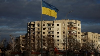 Spy Balloons In Ukraine: A Ukrainian national flag flutters near the buildings destroyed by Russian military strike, amid Russia's invasion of Ukraine, in the town of Borodianka, in Kyiv. (Reuters)