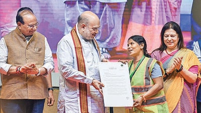 Union minister Amit Shah, along with LG VK Saxena and MoS for external affairs Meenakshi Lekhi, at the event. (Raj K Raj/HT Photo) Union minister Amit Shah, along with LG VK Saxena and MoS for external affairs Meenakshi Lekhi, at the event. (Raj K Raj/HT Photo)