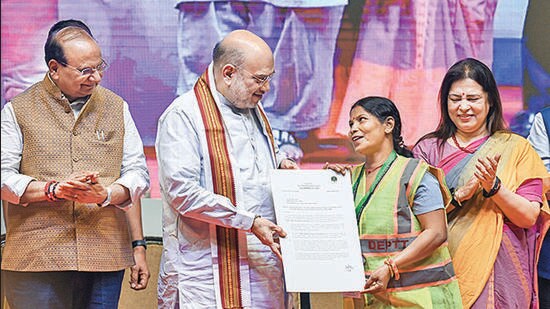 Union minister Amit Shah, along with LG VK Saxena and MoS for external affairs Meenakshi Lekhi, at the event. (Raj K Raj/HT Photo)