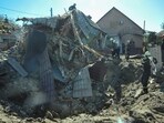 Rescuers work at the site of a residential area heavily damaged by a Russian missile strike, amid Russia's attack on Ukraine, in Zaporizhzhia, Ukraine.
