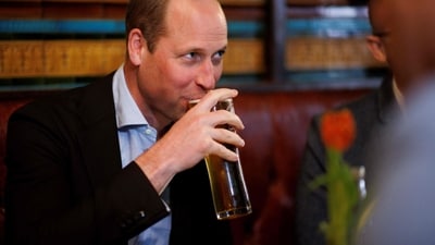 Britain's Prince William, Prince of Wales drinks a beer as he visits the Dog & Duck Pub in Soho, central London. (AFP) Britain's Prince William, Prince of Wales drinks a beer as he visits the Dog & Duck Pub in Soho, central London. (AFP)