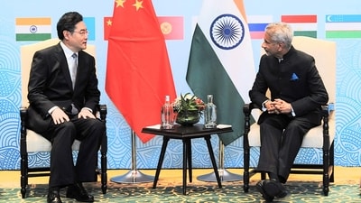 India's Foreign Minister Subrahmanyam Jaishankar (R) speaking with his Chinese counterpart Qin Gang on the sidelines of the SCO meeting. (AFP)
