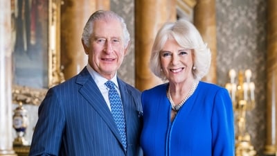 Britain's King Charles III and Queen Consort Camilla pose for a photo in the Blue Drawing Room at Buckingham Palace, London. (AP)
