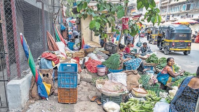 Mumbai, India - March 17, 2023: Footpath crowded with hawkers, makeshift shops, construction material dumped and suitable for walking. Chetana Thakker walks on the footpath from MG Road to LBS Marg via Bhakti Marg, at Mulund (West), in Mumbai, India, on Friday, March 17, 2023. (Photo by Satish Bate/ Hindustan Times) (Satish Bate/HT PHOTO) Mumbai, India - March 17, 2023: Footpath crowded with hawkers, makeshift shops, construction material dumped and suitable for walking. Chetana Thakker walks on the footpath from MG Road to LBS Marg via Bhakti Marg, at Mulund (West), in Mumbai, India, on Friday, March 17, 2023. (Photo by Satish Bate/ Hindustan Times) (Satish Bate/HT PHOTO)