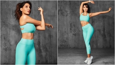 Nora Fatehi did a photoshoot dressed in stylish athleisure fits. She slipped into two different ensembles for the pictures. The first set of images shows her in a light blue-coloured sports bra and gym tights, styled with a side-parted messy ponytail, chunky white lace-up sneakers, a smartwatch, ear studs, and glowing skin. (Instagram) Nora Fatehi did a photoshoot dressed in stylish athleisure fits. She slipped into two different ensembles for the pictures. The first set of images shows her in a light blue-coloured sports bra and gym tights, styled with a side-parted messy ponytail, chunky white lace-up sneakers, a smartwatch, ear studs, and glowing skin. (Instagram)