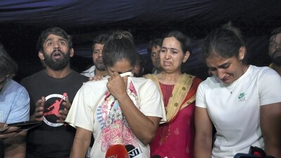 Wrestlers speak with the media after an scuffle between wrestlers and the police at Jantar Mantar in New Delhi. (PTI) Wrestlers speak with the media after an scuffle between wrestlers and the police at Jantar Mantar in New Delhi. (PTI)