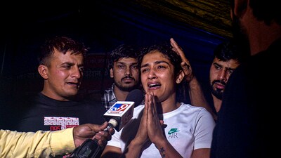 Sangita Phogat reacts while talking to the media after an scuffle between wrestlers and the police at Jantar Mantar, in New Delhi. (PTI) Sangita Phogat reacts while talking to the media after an scuffle between wrestlers and the police at Jantar Mantar, in New Delhi. (PTI)