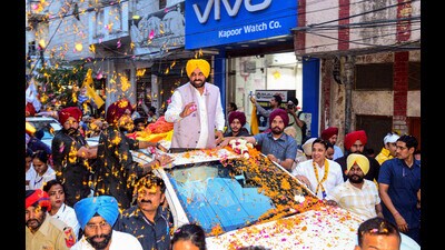 Punjab chief minister Bhagwant Mann during a roadshow ahead of the Jalandhar seat Lok Sabha bypoll, in Jalandhar on Thursday. (PTI)