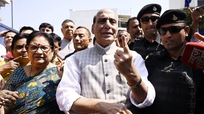 Defence minister Rajnath Singh shows his ink-marked finger after casting his vote outside Scholers home polling booth. (Deepak Gupta / Hindustan Times) Defence minister Rajnath Singh shows his ink-marked finger after casting his vote outside Scholers home polling booth. (Deepak Gupta / Hindustan Times)