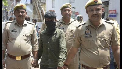 The suspect in custody. (Sakib Ali / HT Photo) The suspect in custody. (Sakib Ali / HT Photo)