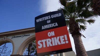 A Writers Guild of America sign at a picket line outside Paramount Studios in Los Angeles, California, US, on Wednesday, May 3, 2023. Photographer: Eric Thayer/Bloomberg (Bloomberg)