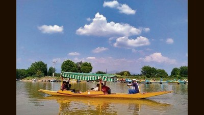 Visitors enjoying the pleasant weather with boating at Sukhna Lake in Chandigarh. (Keshav Singh/HT)