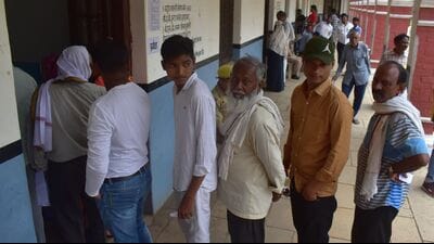 Voters queue up at a booth in Prayagraj on Thursday. (Anil Kumar Maurya/ht photo)