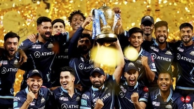 Gujarat Titans with the IPL trophy last year. (PTI) Gujarat Titans with the IPL trophy last year. (PTI)