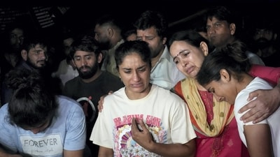 Wrestlers speak with the media after a scuffle allegedly broke out between protesting wrestlers and the police at Jantar Mantar, in New Delhi, late Wednesday, May 3, 2023. (PTI) Wrestlers speak with the media after a scuffle allegedly broke out between protesting wrestlers and the police at Jantar Mantar, in New Delhi, late Wednesday, May 3, 2023. (PTI)