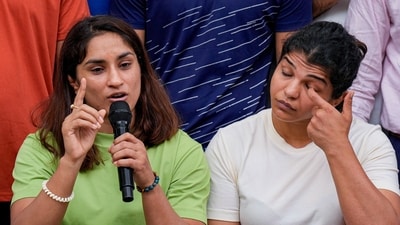 Wrestlers Vinesh Phogat and Sakshi Malik address the media during their protest at Jantar Mantar, in New Delhi, Tuesday, May 2, 2023. (PTI) Wrestlers Vinesh Phogat and Sakshi Malik address the media during their protest at Jantar Mantar, in New Delhi, Tuesday, May 2, 2023. (PTI)