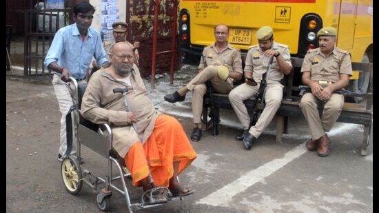A man in wheelchair arrives at a polling centre to cast vote in Prayagraj on Thursday. (Anil Kumar Maurya/HT)