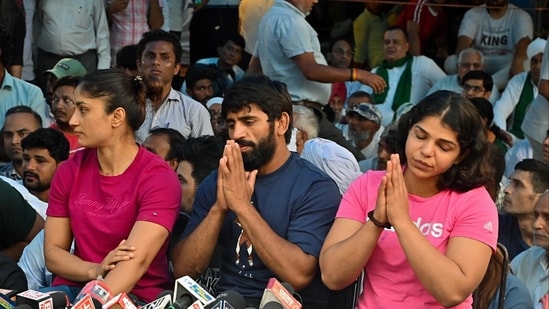 Wrestlers Bajrang Punia, Vinesh Phogat and Sakshi Mallik addresses the press conference in the ongoing protest against the Wrestling Federation of India (WFI) chief Brij Bhushan Sharan Singh, at Jantar Mantar, in New Delhi on Thursday. Wrestlers Bajrang Punia, Vinesh Phogat and Sakshi Mallik addresses the press conference in the ongoing protest against the Wrestling Federation of India (WFI) chief Brij Bhushan Sharan Singh, at Jantar Mantar, in New Delhi on Thursday.