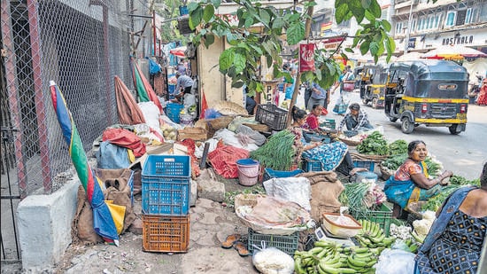 Mumbai, India - March 17, 2023: Footpath crowded with hawkers, makeshift shops, construction material dumped and suitable for walking. Chetana Thakker walks on the footpath from MG Road to LBS Marg via Bhakti Marg, at Mulund (West), in Mumbai, India, on Friday, March 17, 2023. (Photo by Satish Bate/ Hindustan Times) (Satish Bate/HT PHOTO)