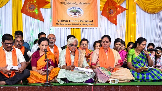 Union minister of state for agriculture Shobha Karandlaje, along with BJP supporters, recites Hanuman Chalisa at a temple in Bengaluru on Thursday. (PTI)