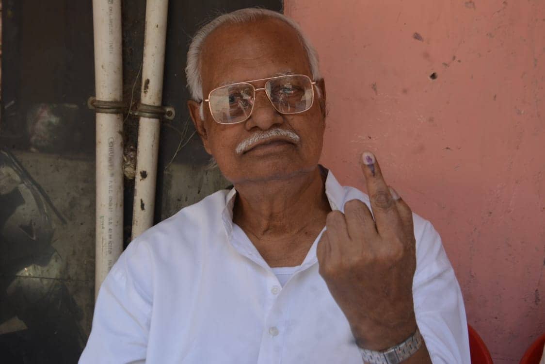 Senior BJP leader Shyam Deo Rai Chaudhary showing indelible ink mark on finger after casting vote. Senior BJP leader Shyam Deo Rai Chaudhary showing indelible ink mark on finger after casting vote.