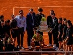 Carlos Alcaraz, of Spain, center down, poses with a cake for his 20th birthday after his victory over Borna Coric Carlos Alcaraz, of Spain, center down, poses with a cake for his 20th birthday after his victory over Borna Coric