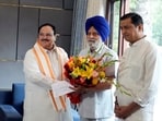 BJP National President J.P. Nadda greets former Punjab Assembly speaker Charanjit Singh Atwal as the latter joins BJP, at his residence in New Delhi.