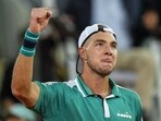 Jan-Lennard Struff, of Germany, celebrates his victory over Greece's Stefanos Tsitsipas during their match at the Madrid Open tennis tournament in Madrid, Spain.