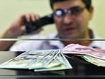 Currency seen at a forex bureau counter in New Delhi. Currency seen at a forex bureau counter in New Delhi.